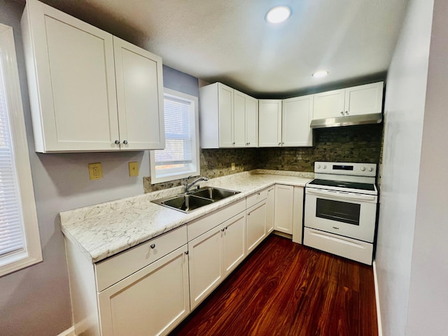 kitchen featuring dark wood-type flooring, light countertops, white electric range, under cabinet range hood, and a sink