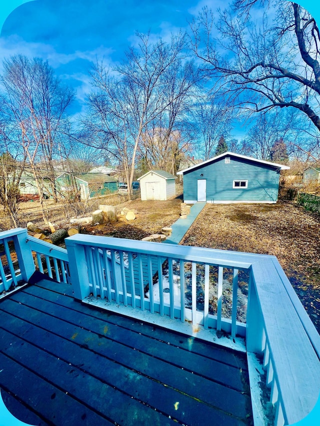 view of pool with a deck and an outdoor structure