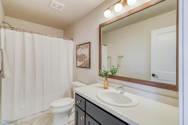 full bathroom featuring visible vents, vanity, and toilet