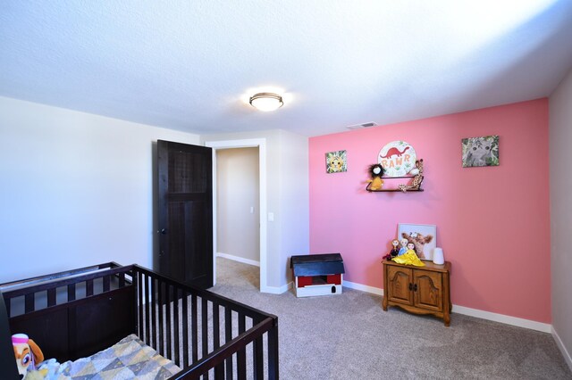 bedroom featuring baseboards, visible vents, and carpet floors