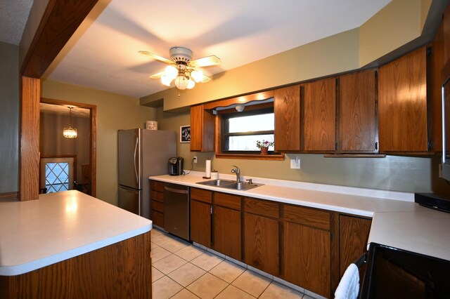 kitchen with a ceiling fan, a sink, light tile patterned floors, light countertops, and dishwashing machine