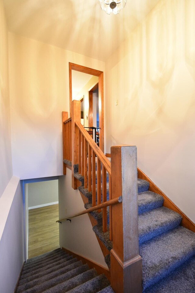 stairway featuring baseboards