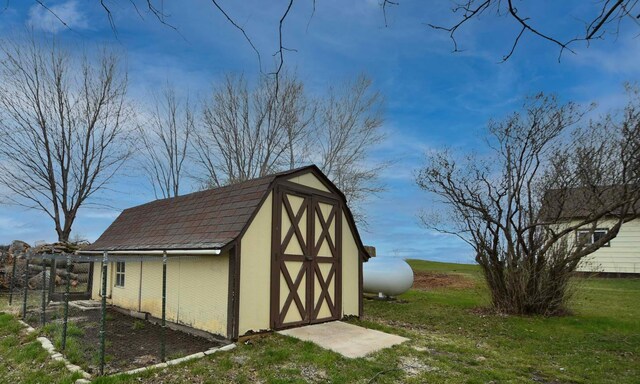 view of shed with fence