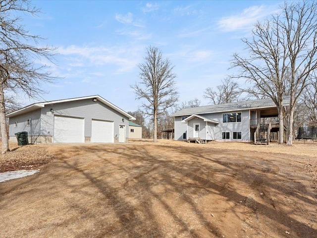 view of front facade with driveway and an outdoor structure