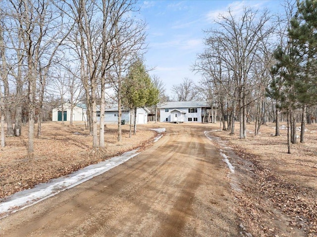 view of street featuring dirt driveway