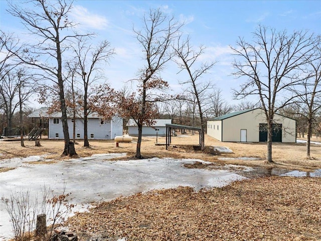 exterior space featuring an outdoor structure, an outbuilding, and a detached garage
