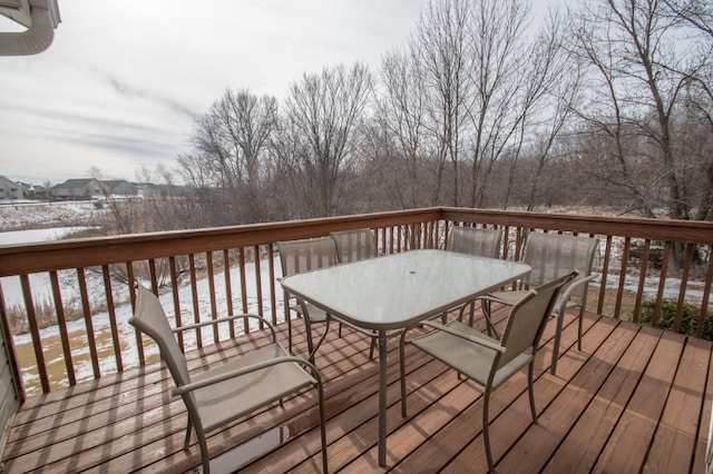 wooden terrace featuring outdoor dining space