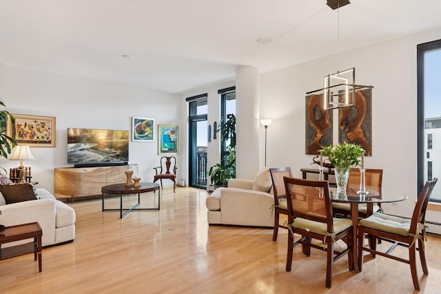 dining space with light wood-type flooring