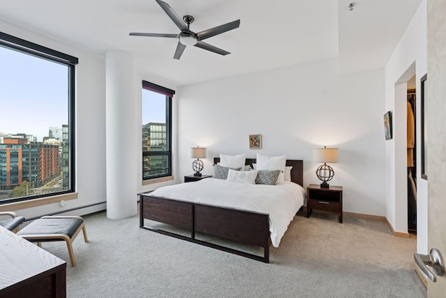 carpeted bedroom featuring a ceiling fan and baseboards