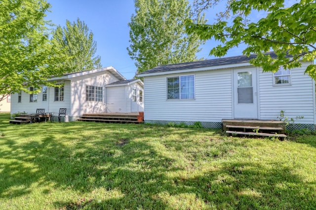 back of house featuring a yard