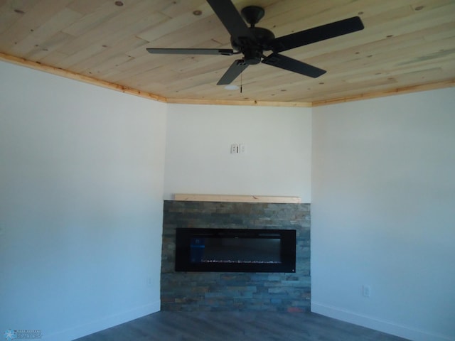 212 May Ave, Page, ND 58064 - unfurnished living room featuring wood ceiling, a stone fireplace, baseboards, and wood finished floors