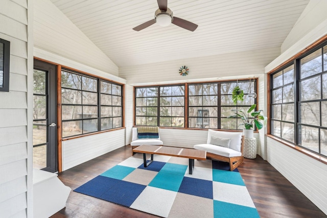 unfurnished sunroom featuring ceiling fan and vaulted ceiling