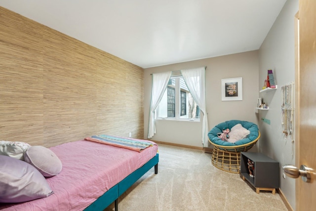 carpeted bedroom featuring baseboards