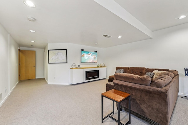 living area featuring light carpet, baseboards, visible vents, a fireplace, and recessed lighting