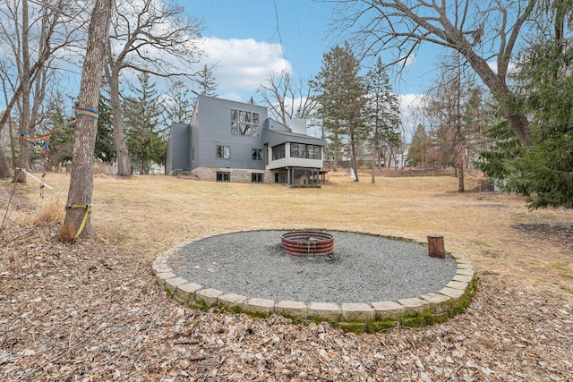 view of yard with an outdoor fire pit