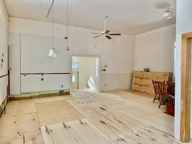 interior space featuring ceiling fan