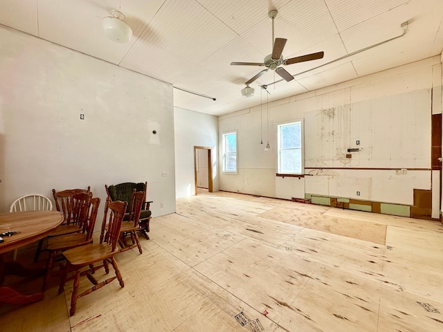 interior space with ceiling fan