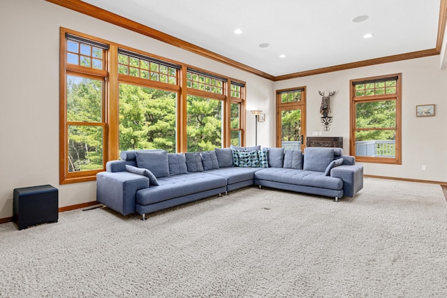 carpeted living area with recessed lighting, crown molding, and baseboards