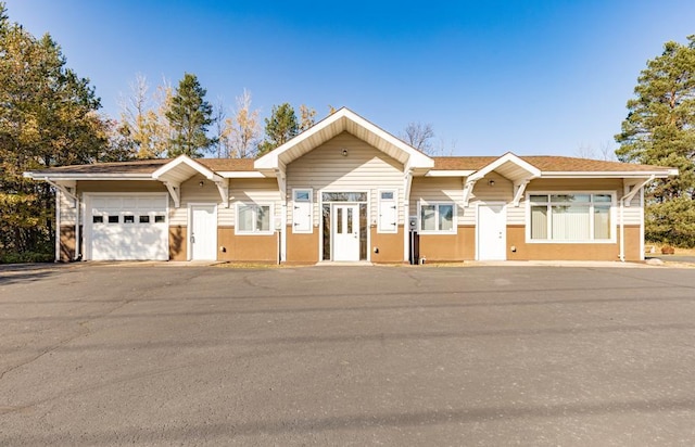 view of front of home with an attached garage and stucco siding