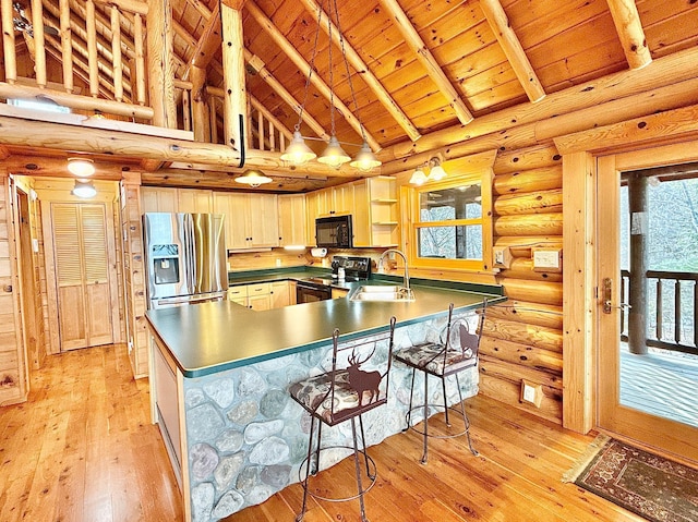 kitchen with black appliances, wooden ceiling, a sink, light wood-type flooring, and a peninsula