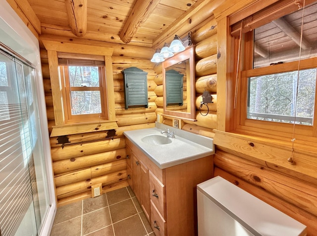 full bathroom featuring wooden ceiling, beam ceiling, vanity, tile patterned flooring, and a stall shower