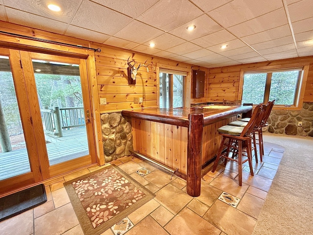 indoor dry bar featuring recessed lighting and light colored carpet