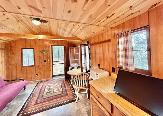 bedroom featuring vaulted ceiling, multiple windows, wood walls, wooden ceiling, and access to outside