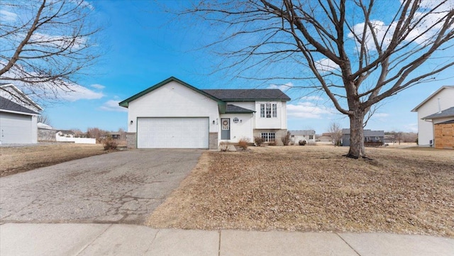 view of front facade with driveway and an attached garage