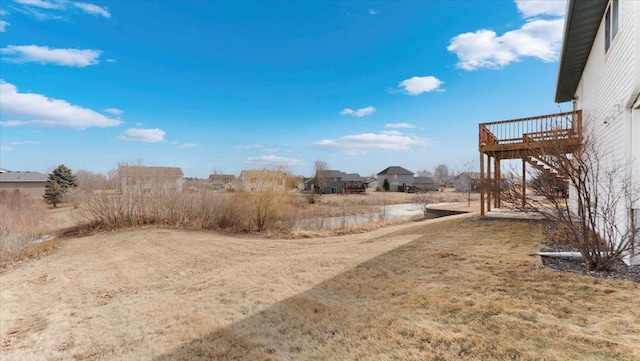 view of yard featuring a wooden deck