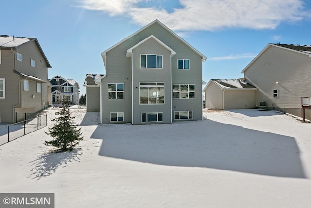 rear view of property with fence