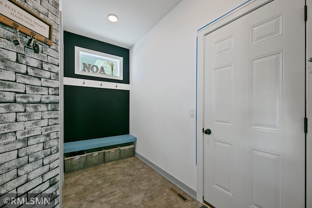 mudroom featuring baseboards and visible vents