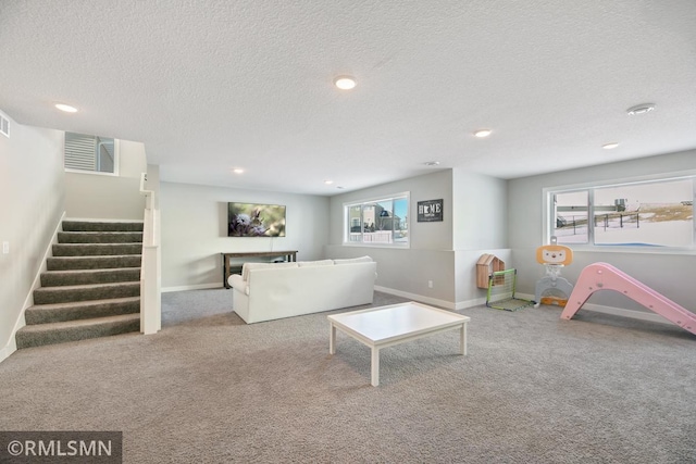 carpeted living room featuring baseboards, visible vents, stairway, a textured ceiling, and recessed lighting