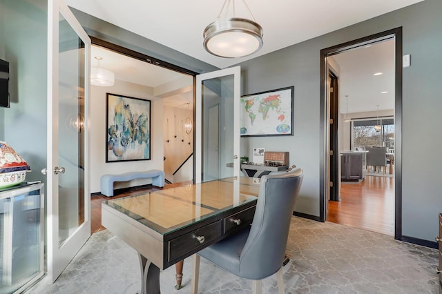 office space featuring french doors, wine cooler, and baseboards