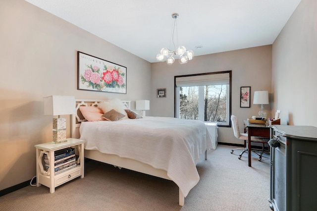 carpeted bedroom featuring baseboards and an inviting chandelier