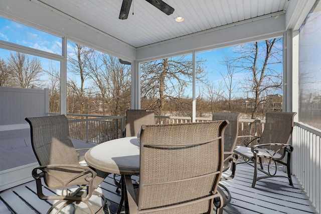 sunroom featuring a ceiling fan