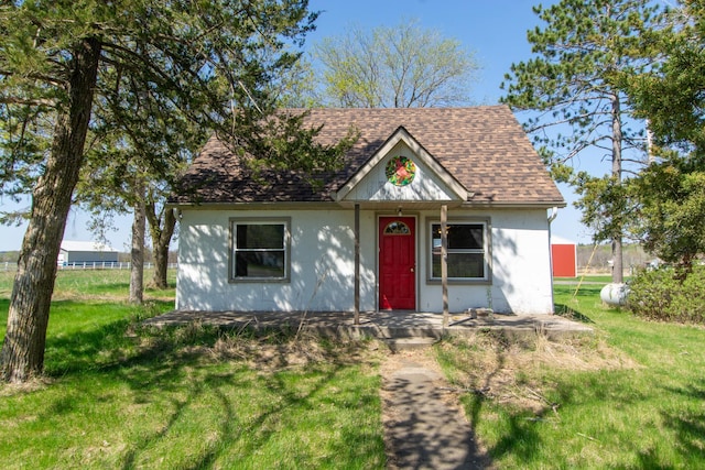 4647 County Road 121, Fort Ripley, MN 56449 - view of front of property featuring a front lawn and a shingled roof