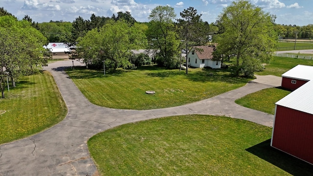 4647 County Road 121, Fort Ripley, MN 56449 - surrounding community with a yard and asphalt driveway