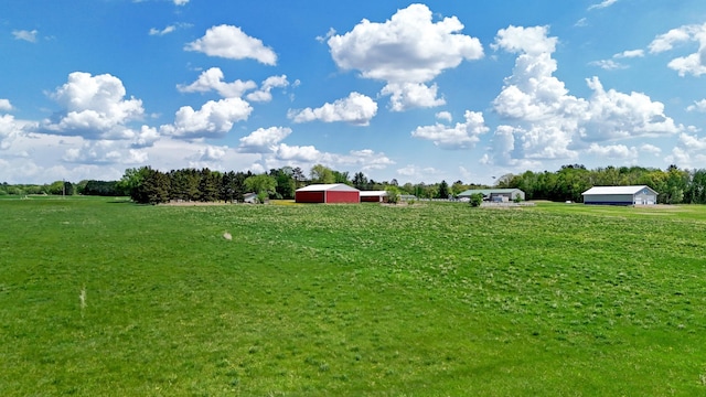4647 County Road 121, Fort Ripley, MN 56449 - view of green lawn with a rural view, an outbuilding, and an outdoor structure