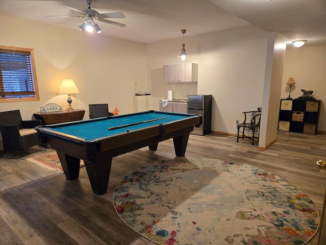 recreation room with baseboards, a ceiling fan, wood finished floors, and pool table