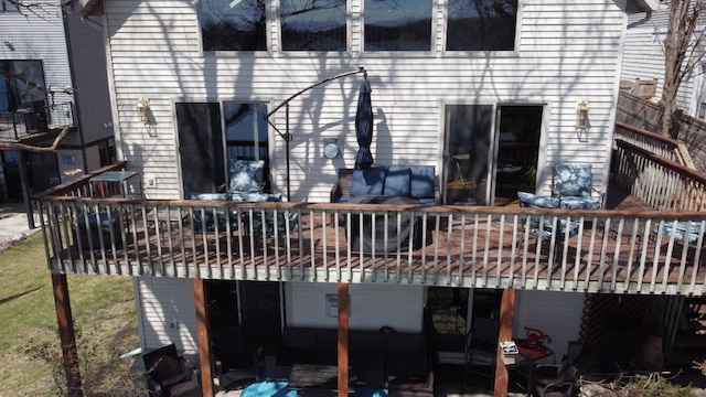 back of house with a wooden deck