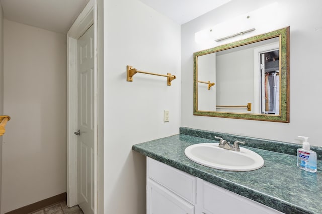 bathroom featuring vanity and baseboards