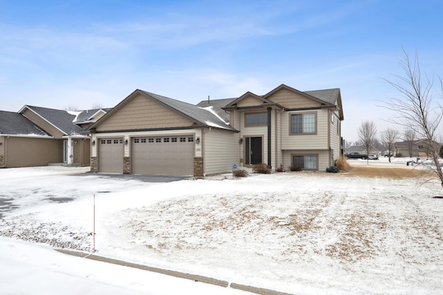 view of front of house with a garage and stone siding