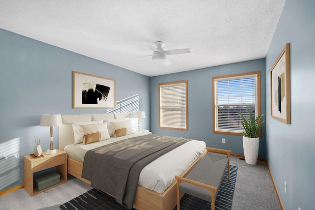 bedroom featuring carpet flooring, ceiling fan, a textured ceiling, and baseboards