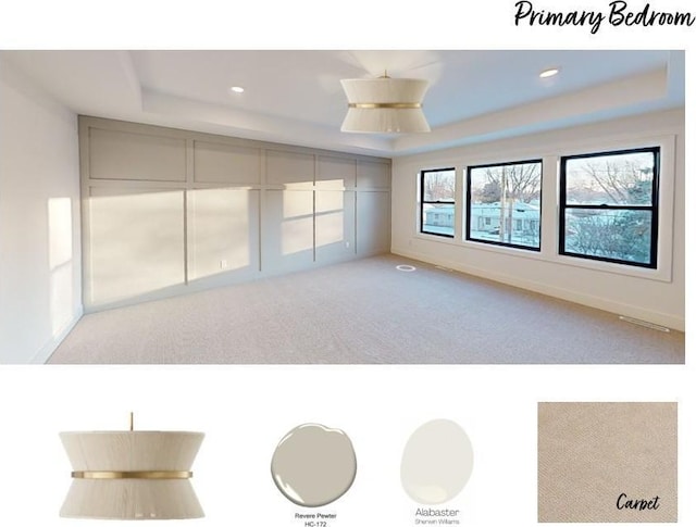 carpeted empty room with a tray ceiling and recessed lighting