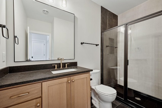 full bathroom with toilet, a stall shower, vanity, and tile patterned floors