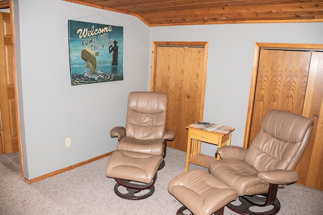 living area featuring carpet, wooden ceiling, and baseboards