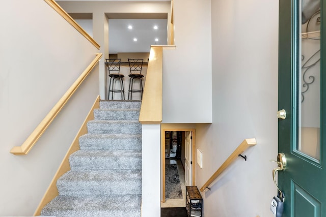 stairs featuring recessed lighting