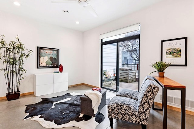 interior space featuring access to exterior, recessed lighting, baseboards, and concrete flooring