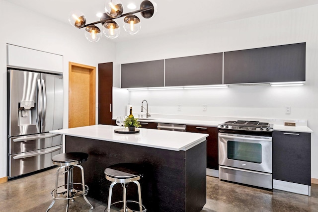 kitchen featuring finished concrete floors, light countertops, modern cabinets, and stainless steel appliances