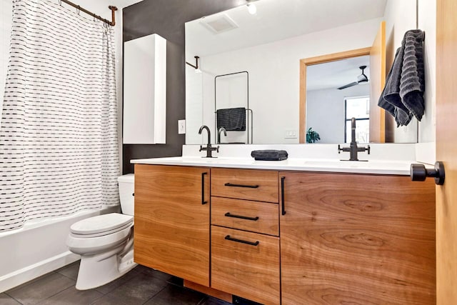 bathroom with shower / bath combo with shower curtain, toilet, a sink, tile patterned flooring, and double vanity